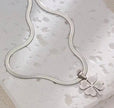 Stainless Steel Necklace With Yellow Four Leaf Clover Pendant